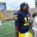 Michigan senior quarterback Denard Robinson smiles as he runs off the field after Michigan beat Air Force 31-25 at Michigan Stadium on Saturday. Melanie Maxwell I AnnArbor.com